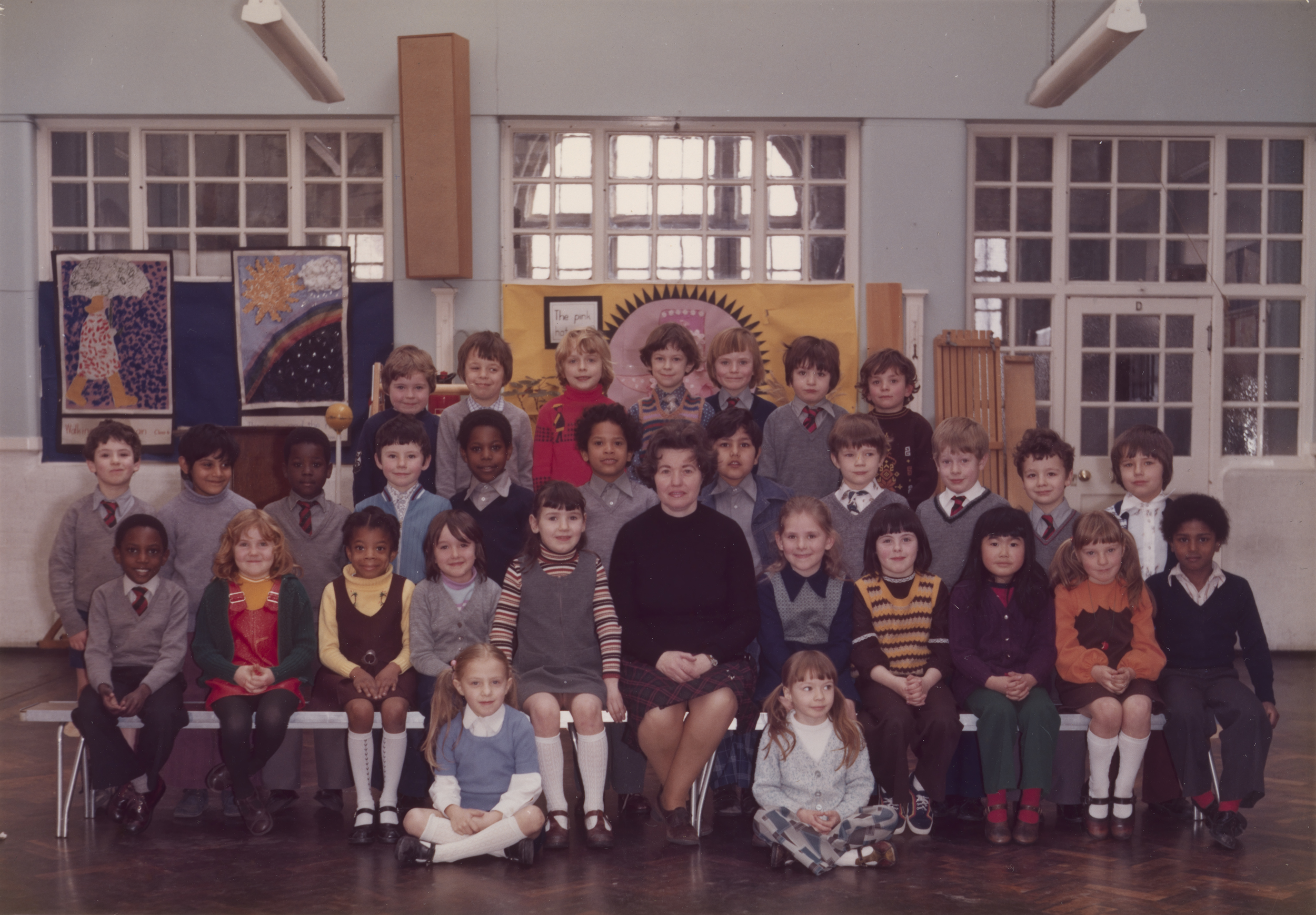 Steve McQueen’s Year 3 class at Little Ealing Primary School, 1977. (Every effort has been made to contact and gain approval from the individuals in this photograph. If you have any new information or are featured in the image, please contact pressoffice@tate.org.uk Steve McQueen is seated fifth from left in the middle row.    